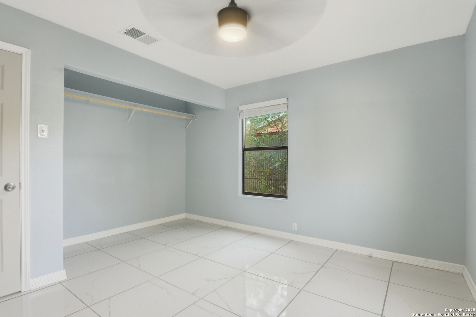 521 Old Carrizo Road Uvalde, TX 78801 - Photo 21 of 31 an empty room with windows and closet