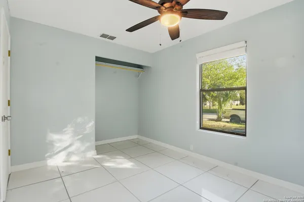 a view of an empty room with a window