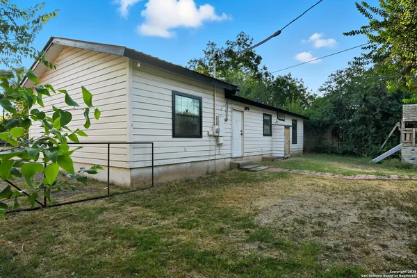 a house view with a backyard space