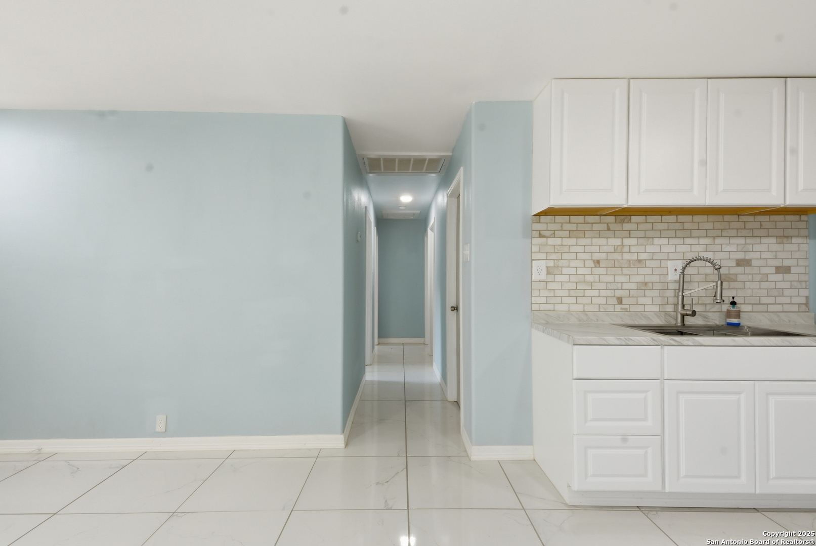 521 Old Carrizo Road Uvalde, TX 78801 - Photo 7 of 31 a bathroom with a sink and cabinets