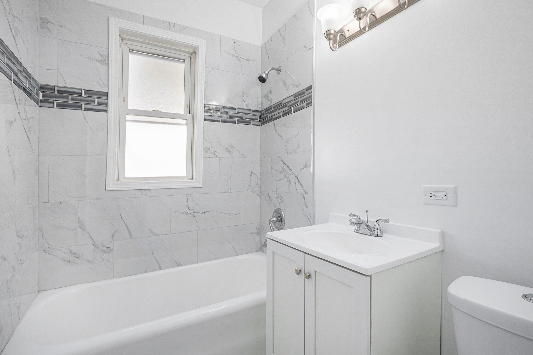 3625 Virginia Street Gary, IN 46409 - Photo 13 of 15 a bathroom with a sink mirror vanity and toilet
