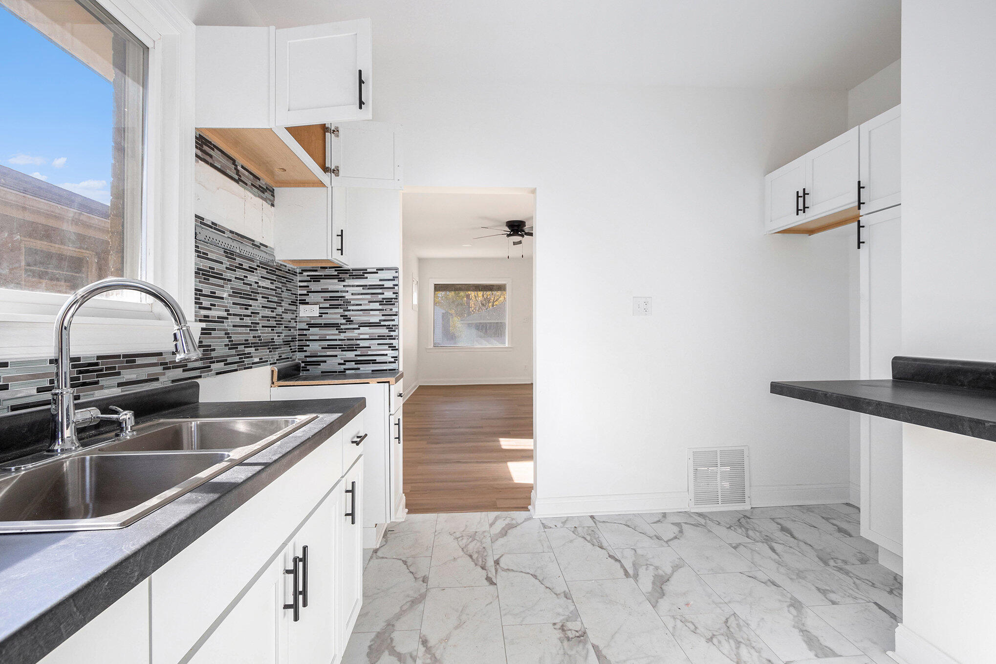 3625 Virginia Street Gary, IN 46409 - Photo 5 of 15 a kitchen with granite countertop a sink and a stove