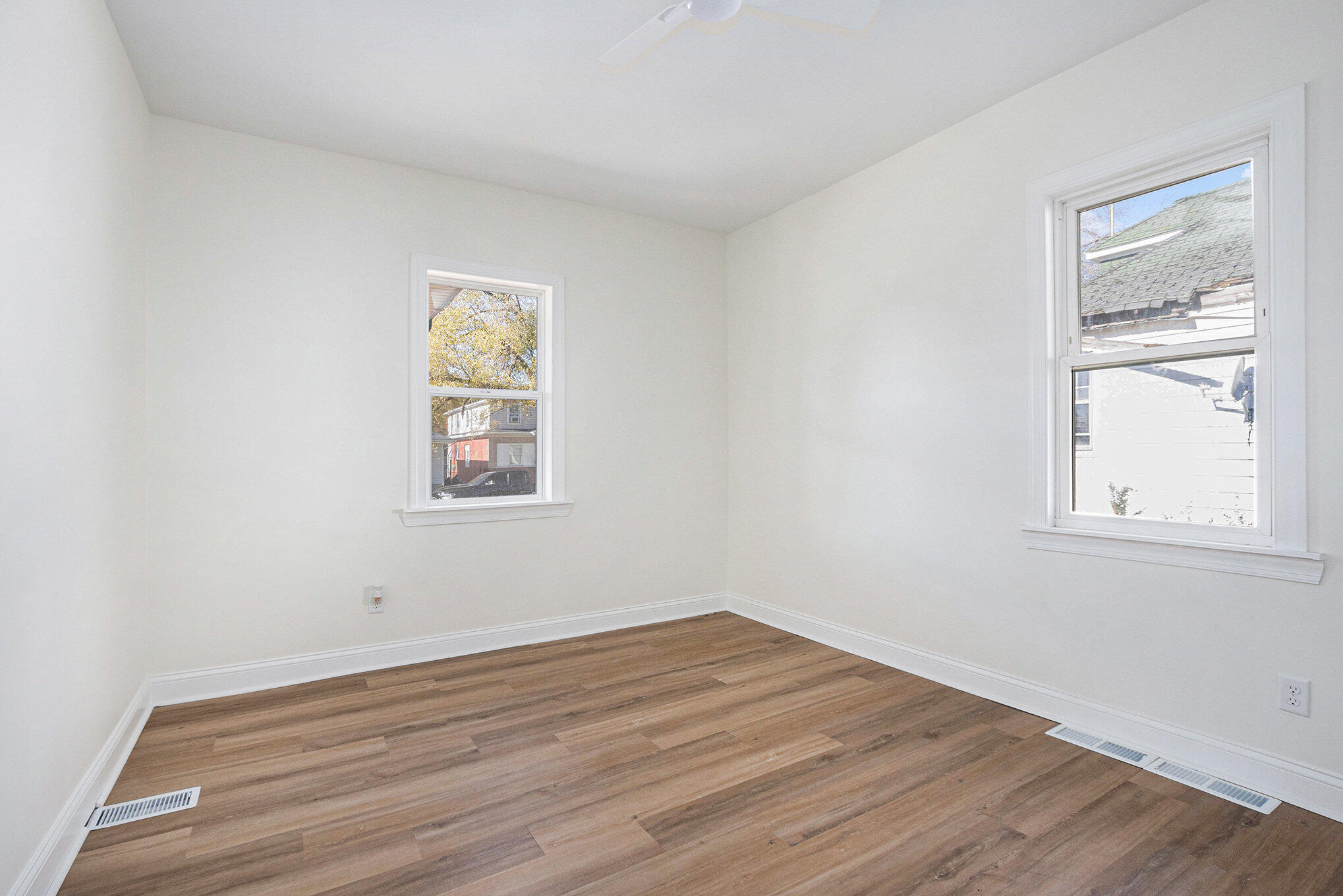 3625 Virginia Street Gary, IN 46409 - Photo 7 of 15 a view of empty room with wooden floor and fan