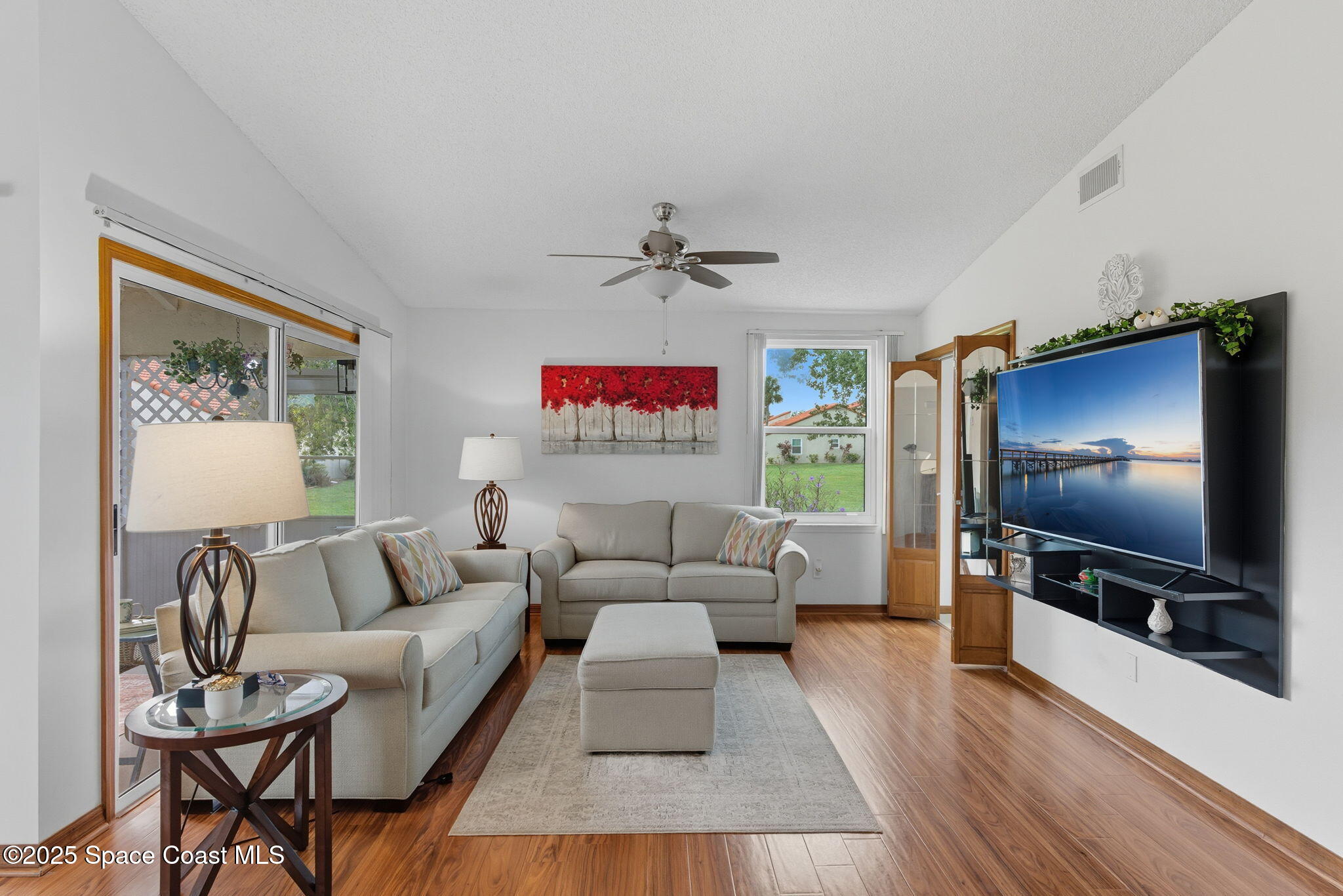 710 Spring Valley Drive Melbourne, FL 32940 - Photo 14 of 30 a living room with furniture and a flat screen tv