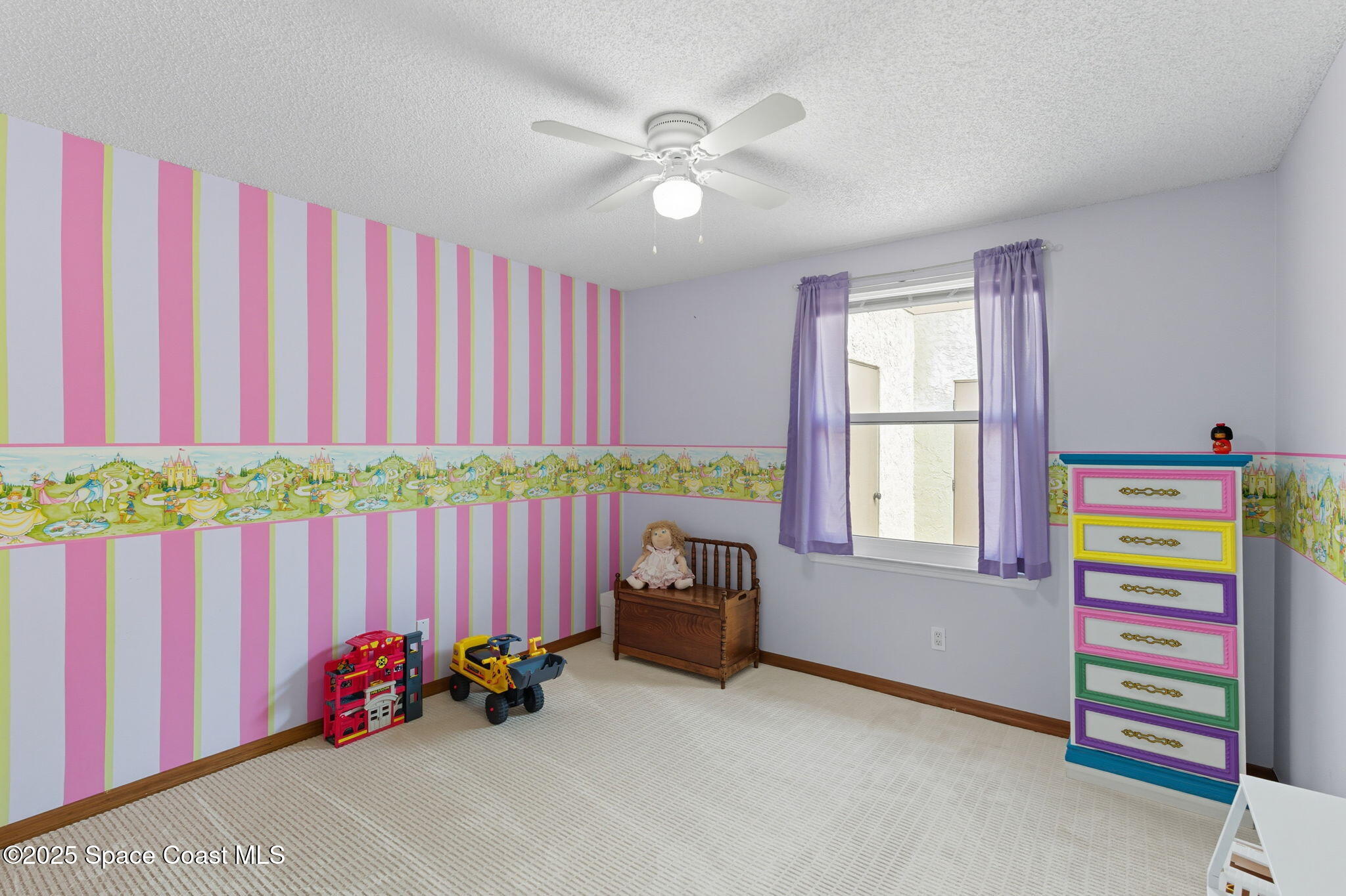 710 Spring Valley Drive Melbourne, FL 32940 - Photo 20 of 30 a living room with furniture and a window