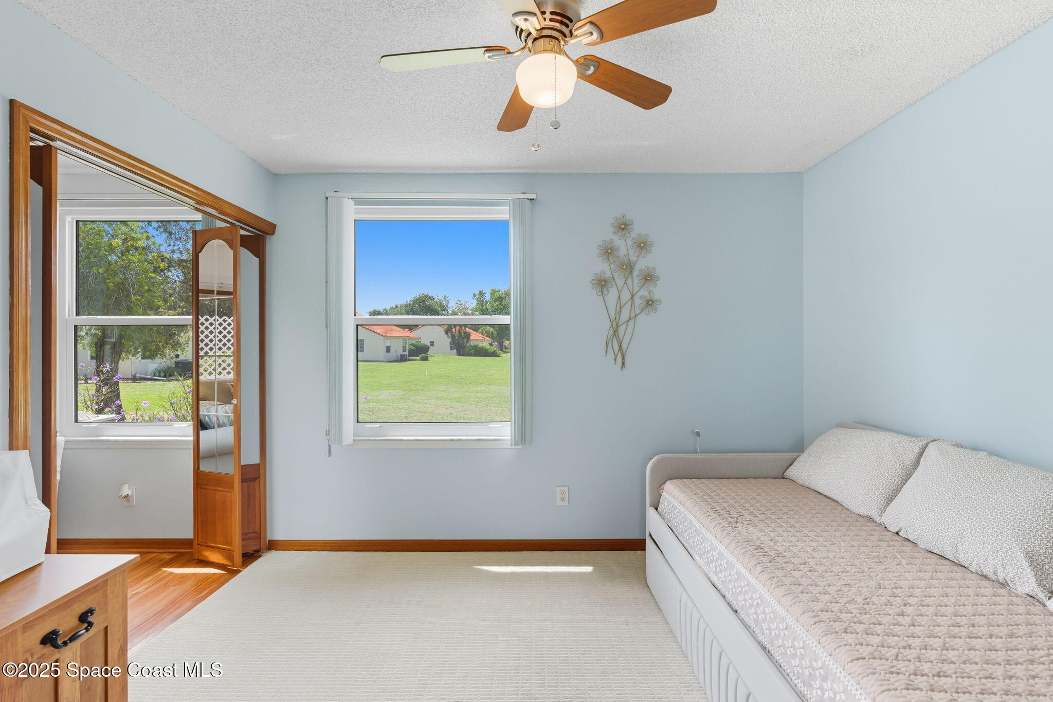 710 Spring Valley Drive Melbourne, FL 32940 - Photo 22 of 30 a bedroom with a bed and a window