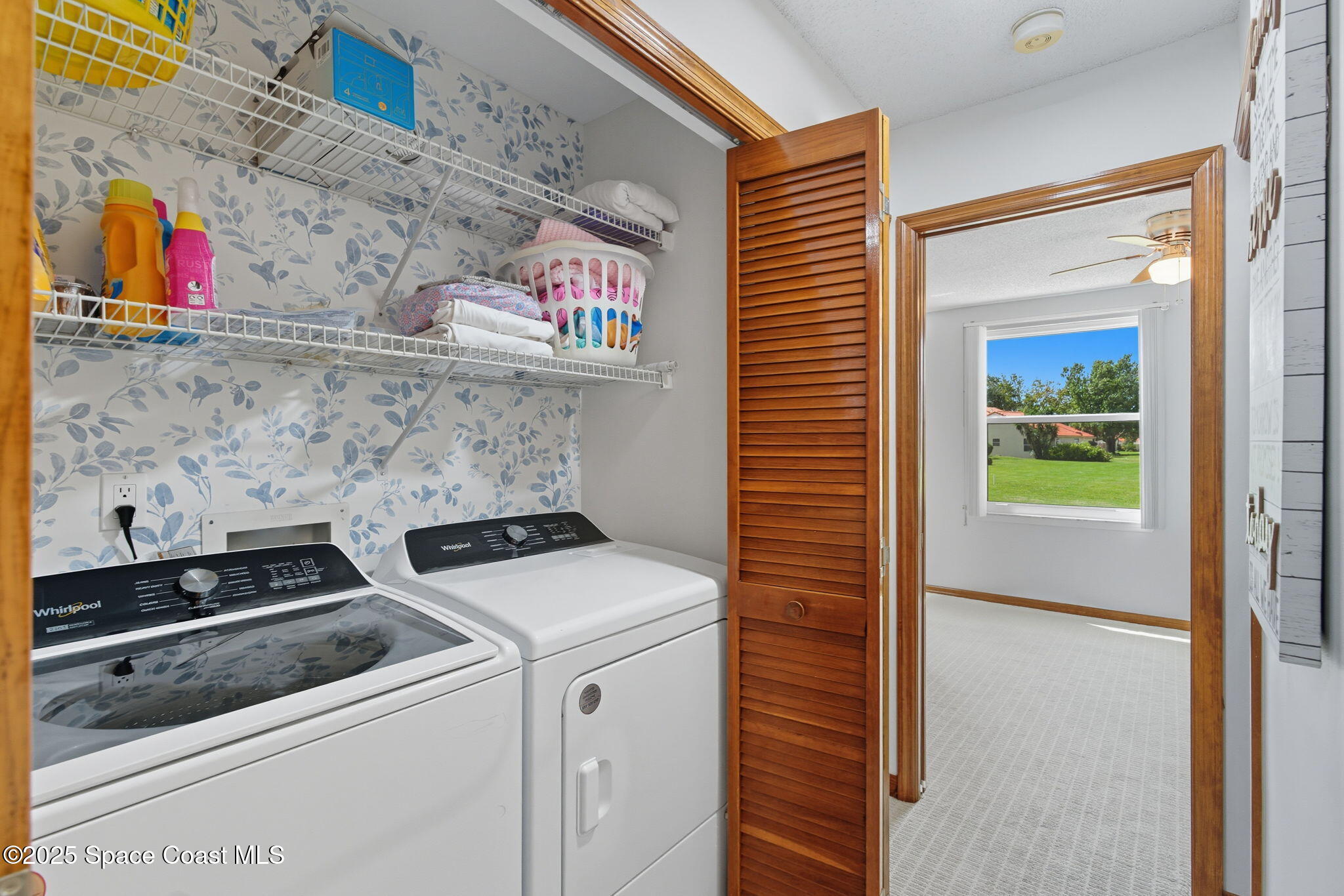 710 Spring Valley Drive Melbourne, FL 32940 - Photo 24 of 30 a utility room with dryer and washer