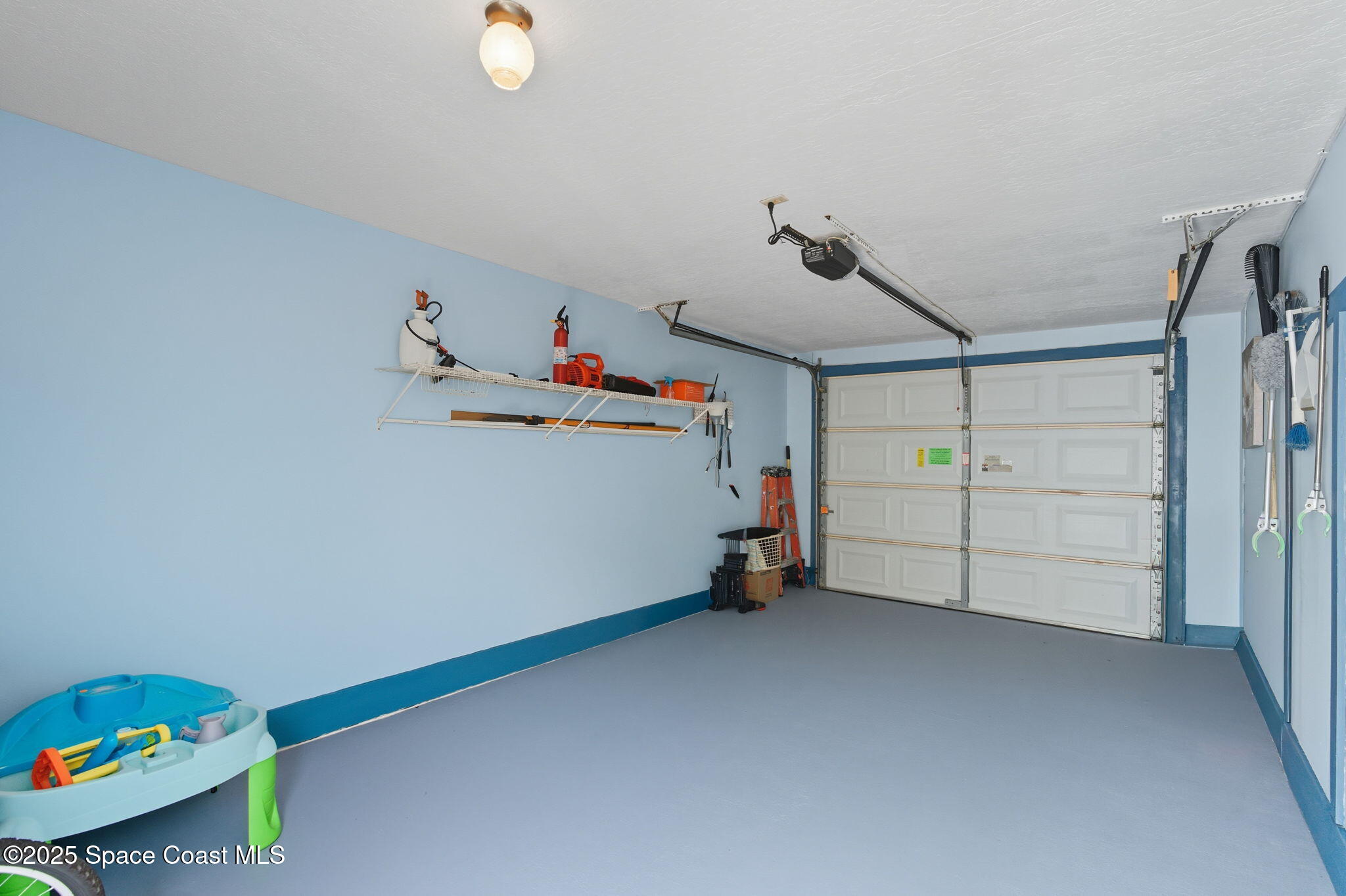 710 Spring Valley Drive Melbourne, FL 32940 - Photo 25 of 30 a view of storage and utility room with toys