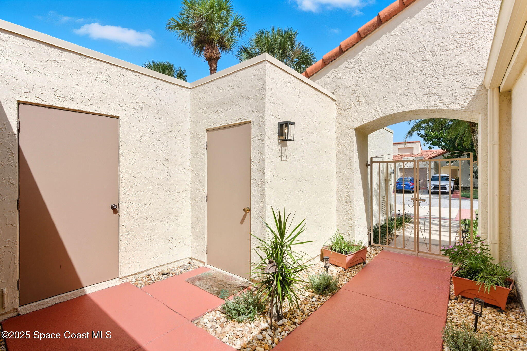 710 Spring Valley Drive Melbourne, FL 32940 - Photo 26 of 30 a balcony with wooden floor and potted plants