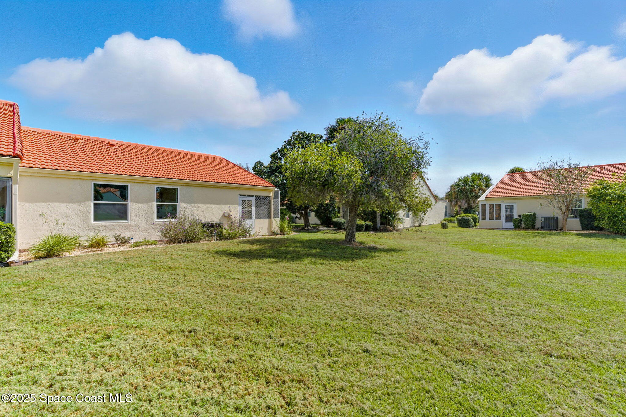 710 Spring Valley Drive Melbourne, FL 32940 - Photo 29 of 30 a front view of house with yard and trees