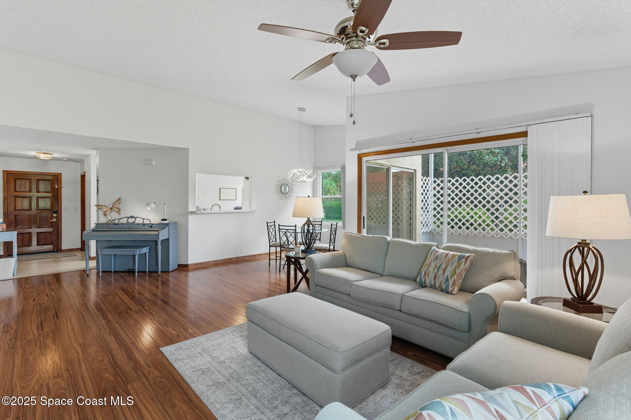 710 Spring Valley Drive Melbourne, FL 32940 - Photo 3 of 30 a living room with furniture and wooden floor