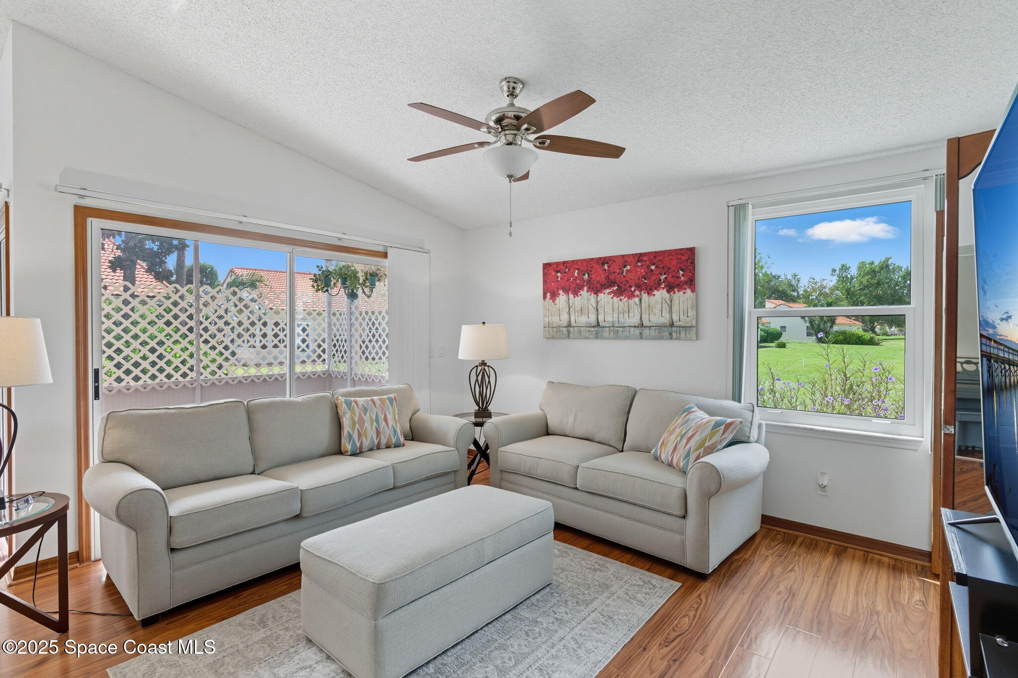 710 Spring Valley Drive Melbourne, FL 32940 - Photo 4 of 30 a living room with furniture and a large window