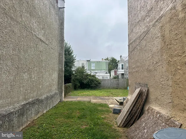 a view of a garden with lawn chairs