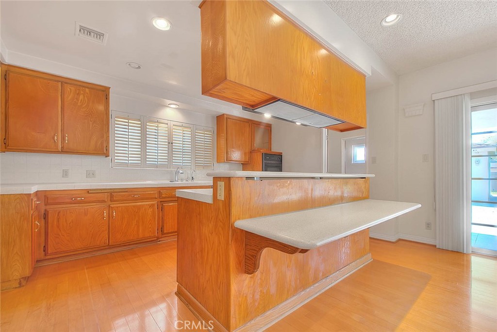 620 North 5th Street Montebello, CA 90640 - Photo 16 of 68 a kitchen with stainless steel appliances granite countertop a sink and a refrigerator