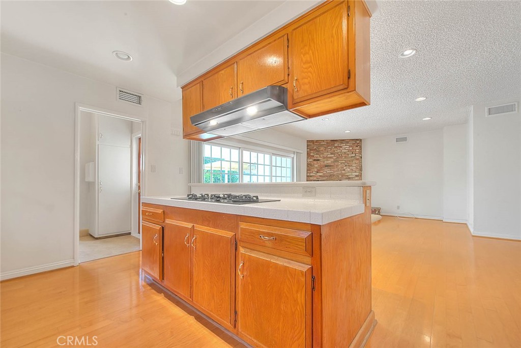 620 North 5th Street Montebello, CA 90640 - Photo 19 of 68 a kitchen with granite countertop a sink and cabinets