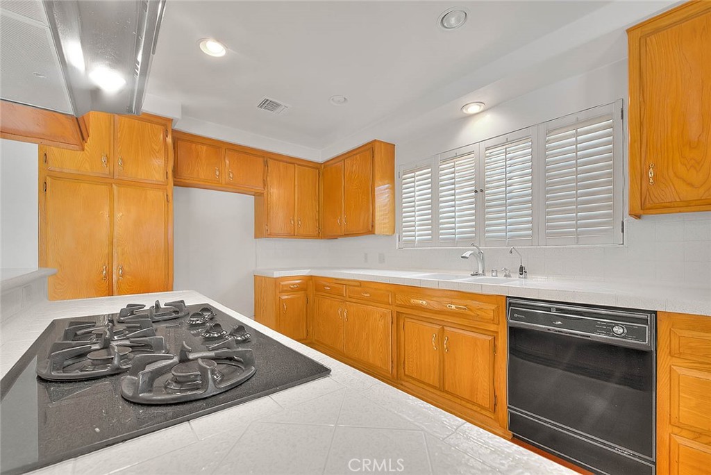 620 North 5th Street Montebello, CA 90640 - Photo 21 of 68 a kitchen with stainless steel appliances granite countertop a sink stove and cabinets