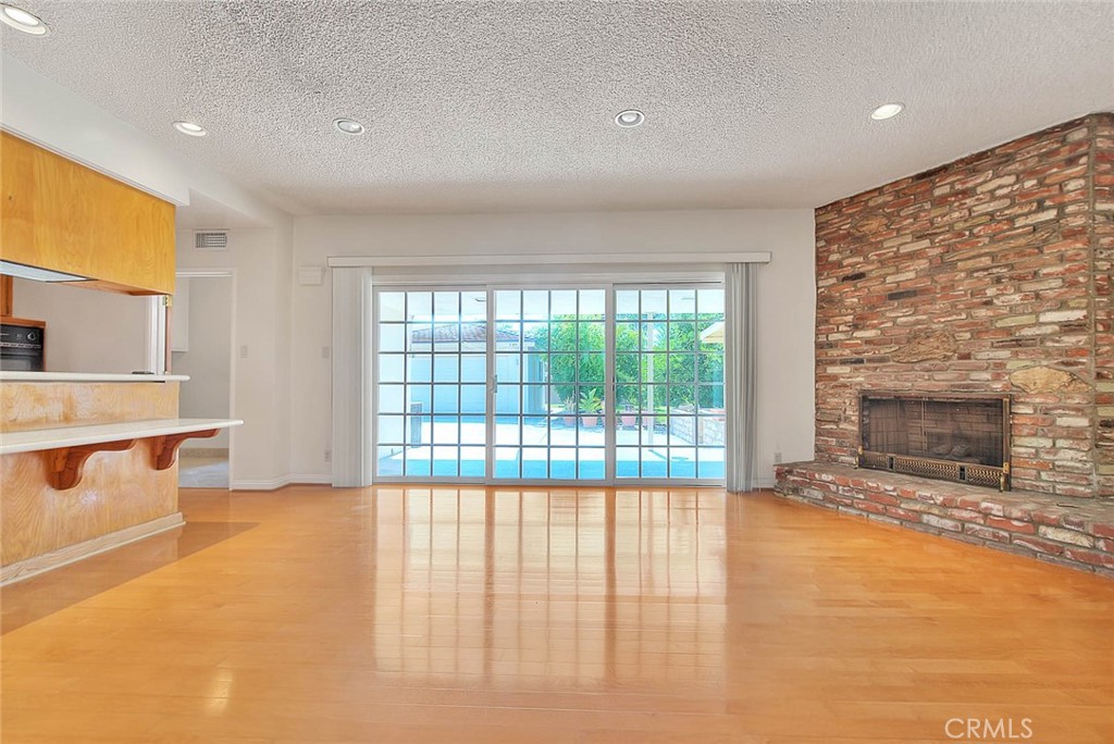 620 North 5th Street Montebello, CA 90640 - Photo 23 of 68 a view of livingroom with kitchen and fireplace