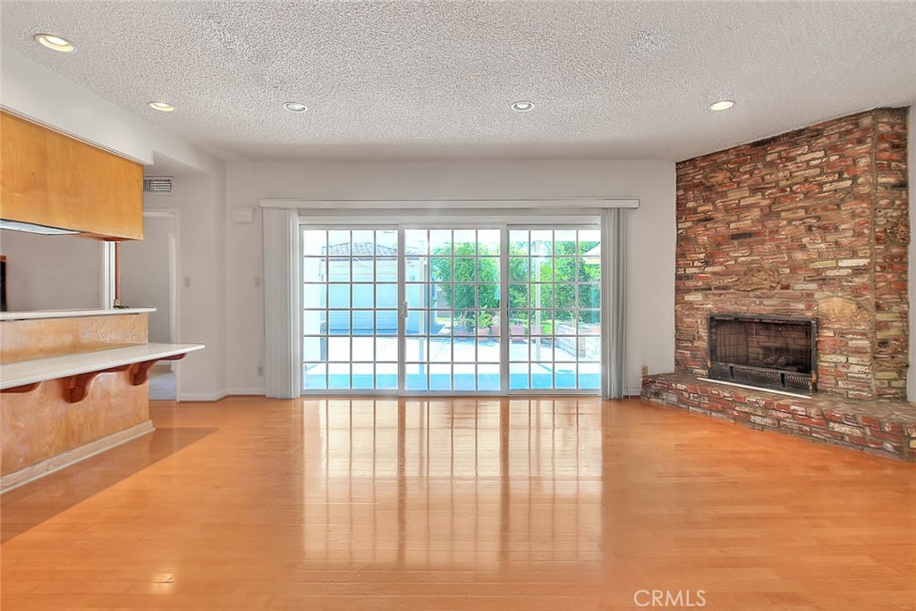 620 North 5th Street Montebello, CA 90640 - Photo 24 of 68 a view of an empty room with a fireplace and a window