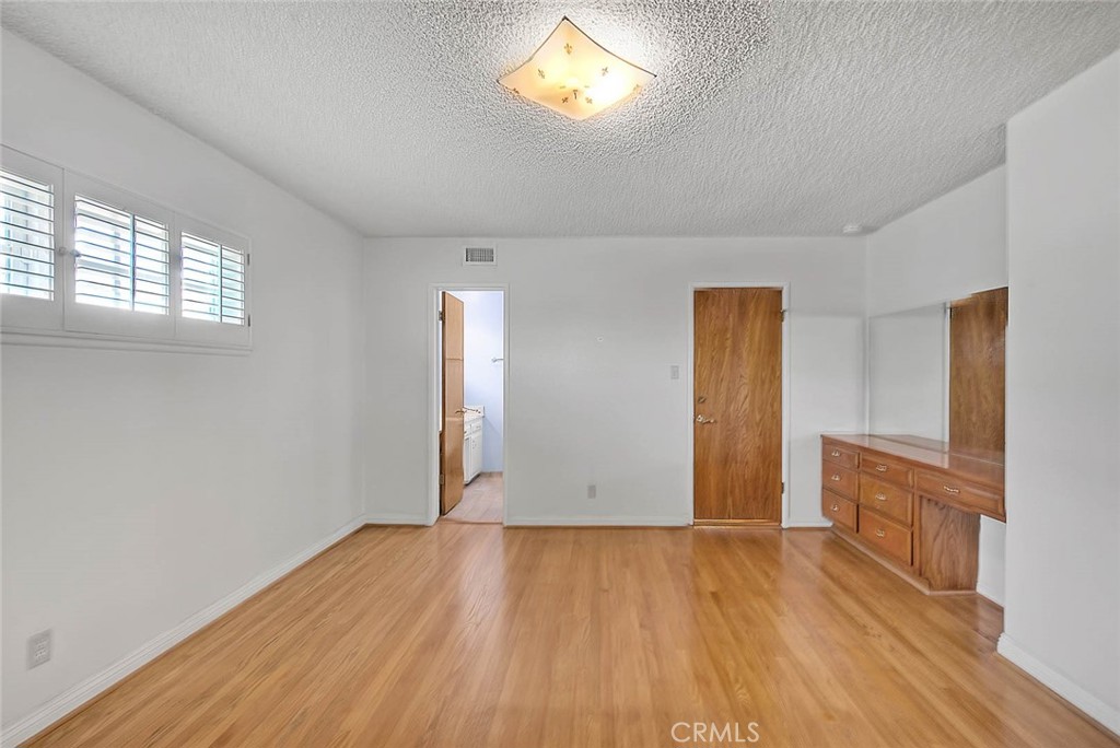 620 North 5th Street Montebello, CA 90640 - Photo 34 of 68 an empty room with wooden floor and a window