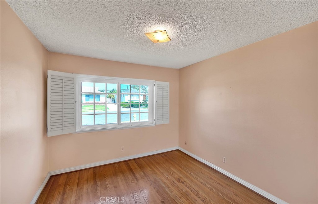620 North 5th Street Montebello, CA 90640 - Photo 43 of 68 an empty room with wooden floor and windows