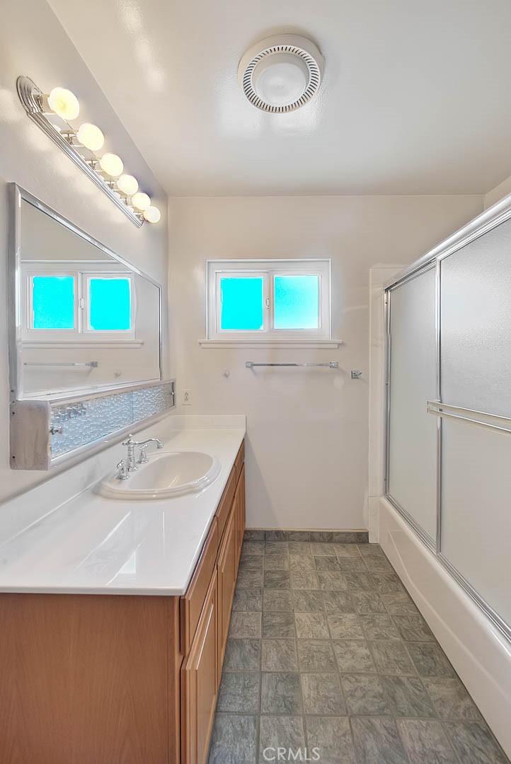 620 North 5th Street Montebello, CA 90640 - Photo 47 of 68 a bathroom with a sink and a mirror