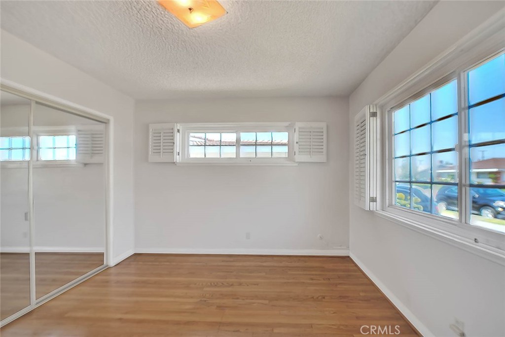 620 North 5th Street Montebello, CA 90640 - Photo 49 of 68 an empty room with wooden floor and windows