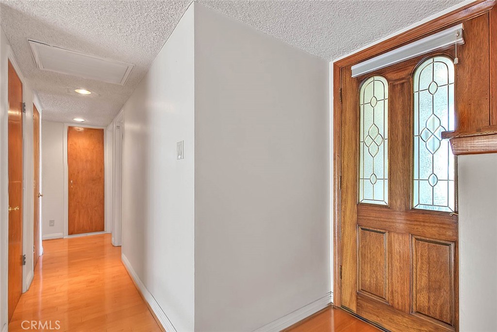 620 North 5th Street Montebello, CA 90640 - Photo 5 of 68 a view of a hallway with wooden floor and a livingroom