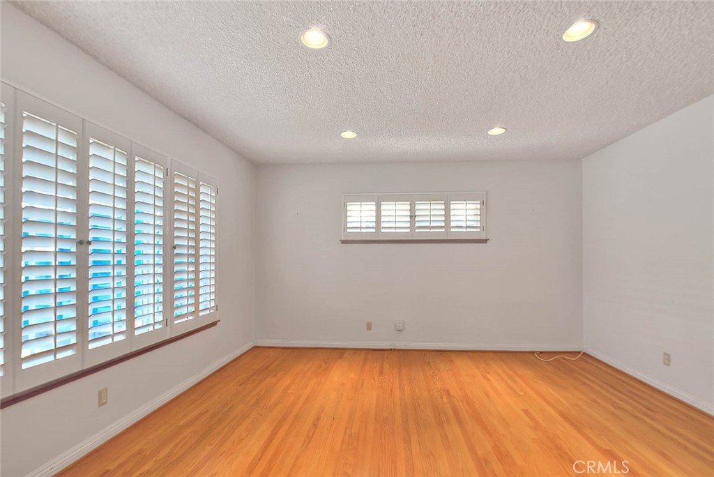 620 North 5th Street Montebello, CA 90640 - Photo 10 of 68 a view of empty room with wooden floor and fan