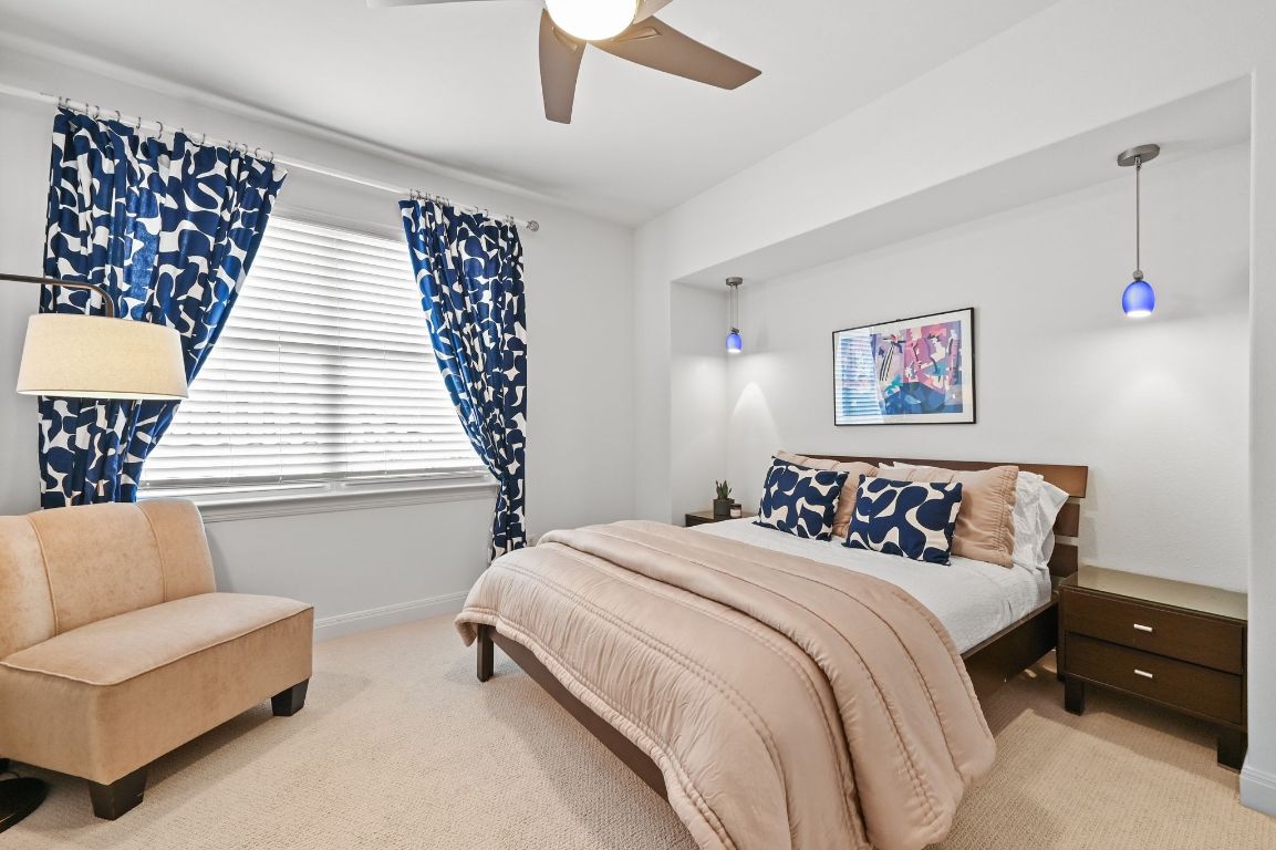 405 Barrett Lane, Unit 1 Austin, TX 78733 - Photo 24 of 26 a bedroom with a bed and a couch