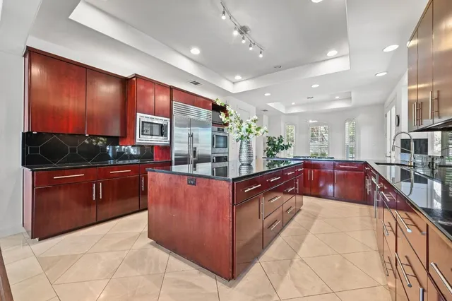 a kitchen with stainless steel appliances granite countertop a large counter top