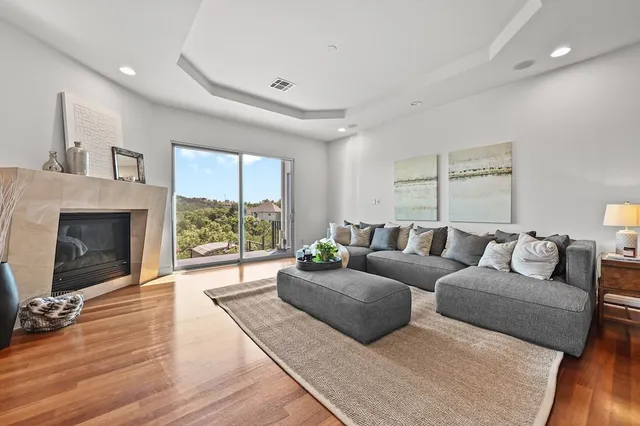 a living room with furniture and a fireplace