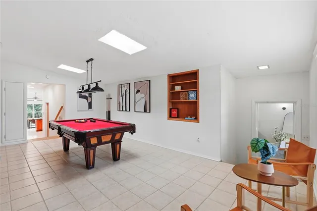 a kitchen with stainless steel appliances granite countertop a sink a stove counter space and cabinets