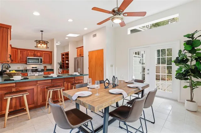 a bathroom with a sink a toilet and a large mirror