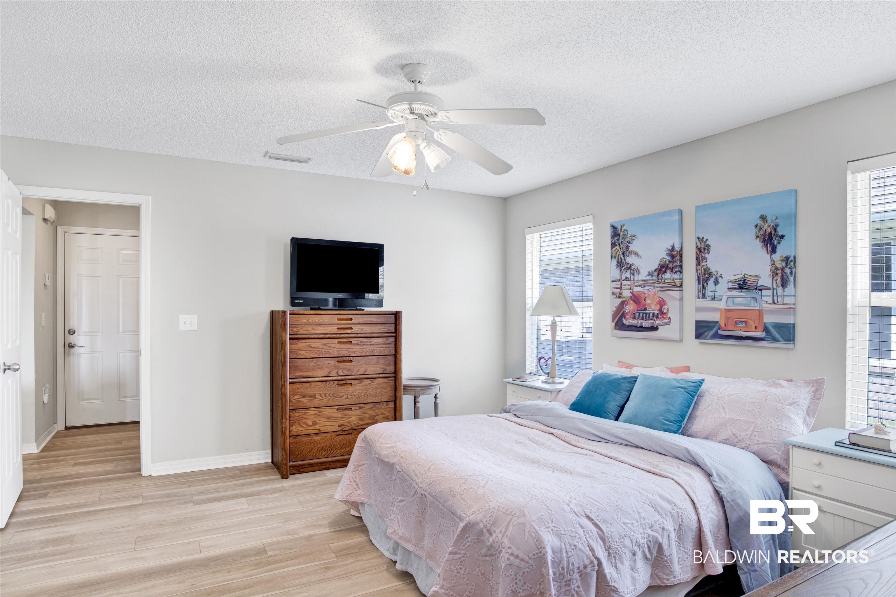 1044 Amazon Drive Foley, AL 36535 - Photo 9 of 29 Bedroom with multiple windows, a textured ceiling, ceiling fan, and light wood-type flooring