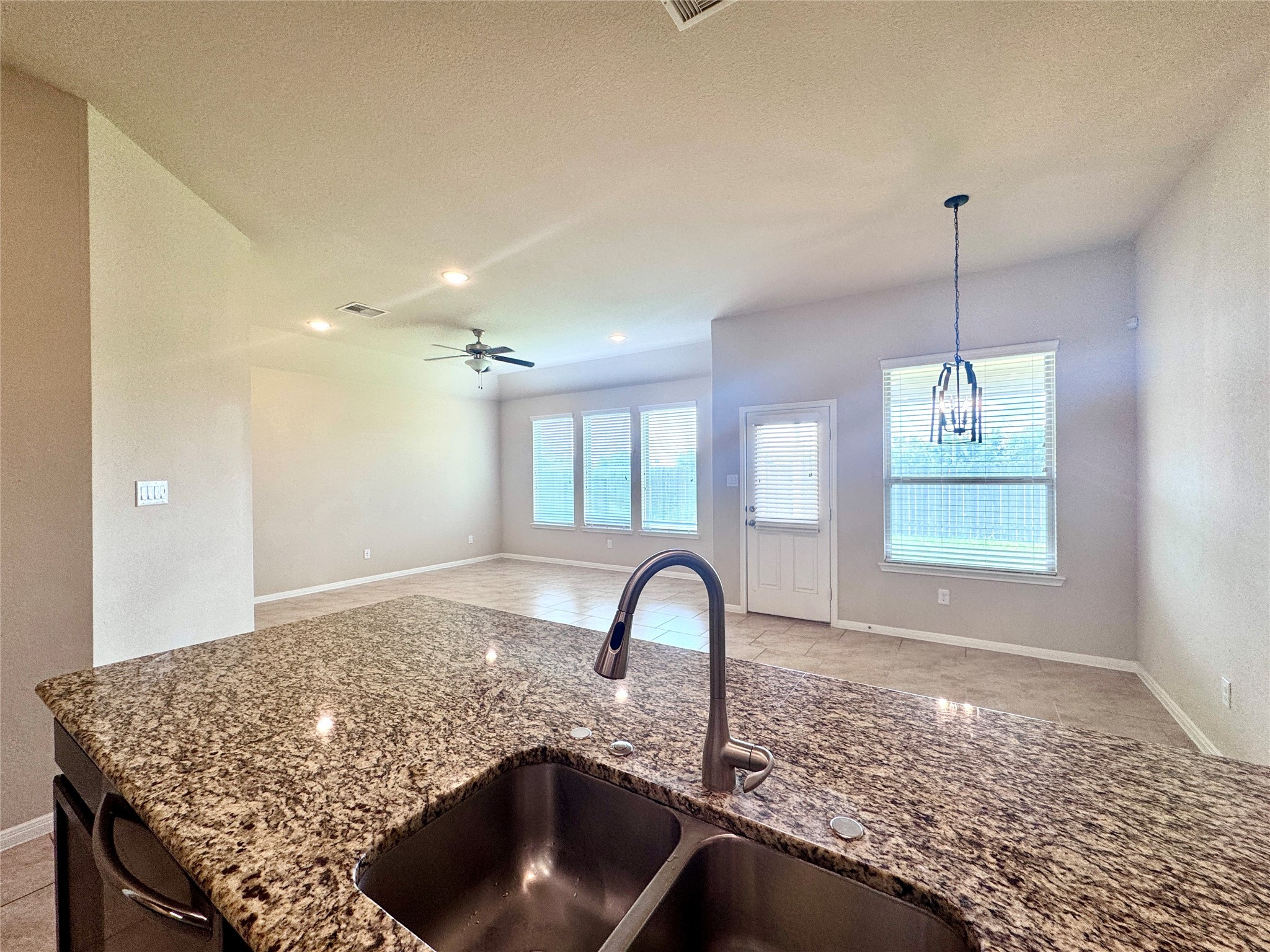 22227 Ebbets Field Drive Spring, TX 77389 - Photo 6 of 29 kitchen overlooks breakfast and living room
