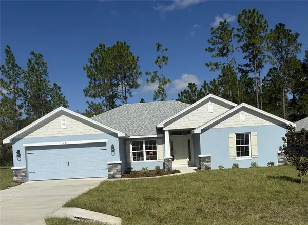 front view of a house with a yard