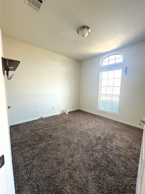 223 Garden Grove Drive Waxahachie, TX 75165 - Photo 17 of 24 a view of empty room with window