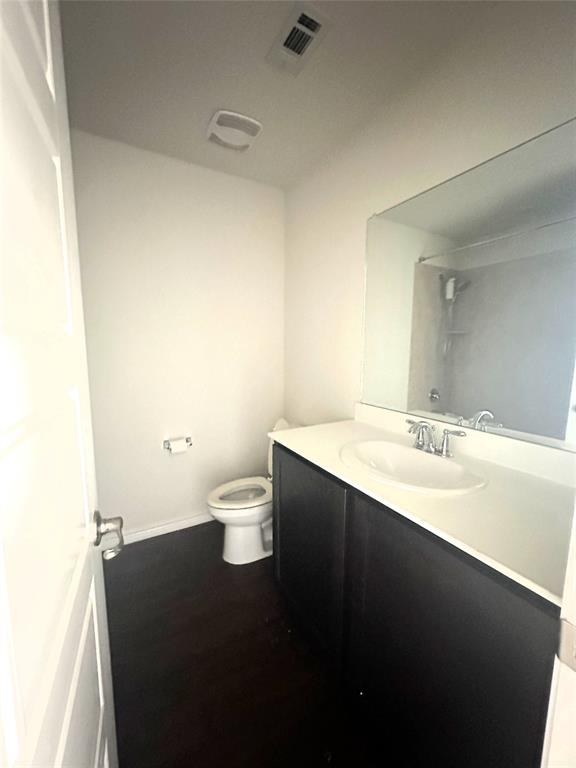 223 Garden Grove Drive Waxahachie, TX 75165 - Photo 19 of 24 a bathroom with a sink and a toilet