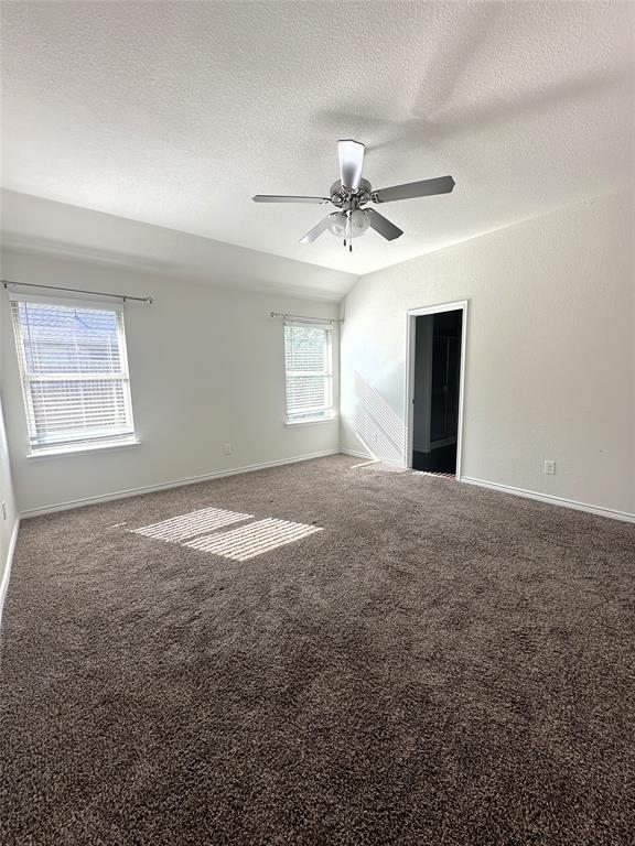 223 Garden Grove Drive Waxahachie, TX 75165 - Photo 8 of 24 a view of a big room with windows and chandelier fan