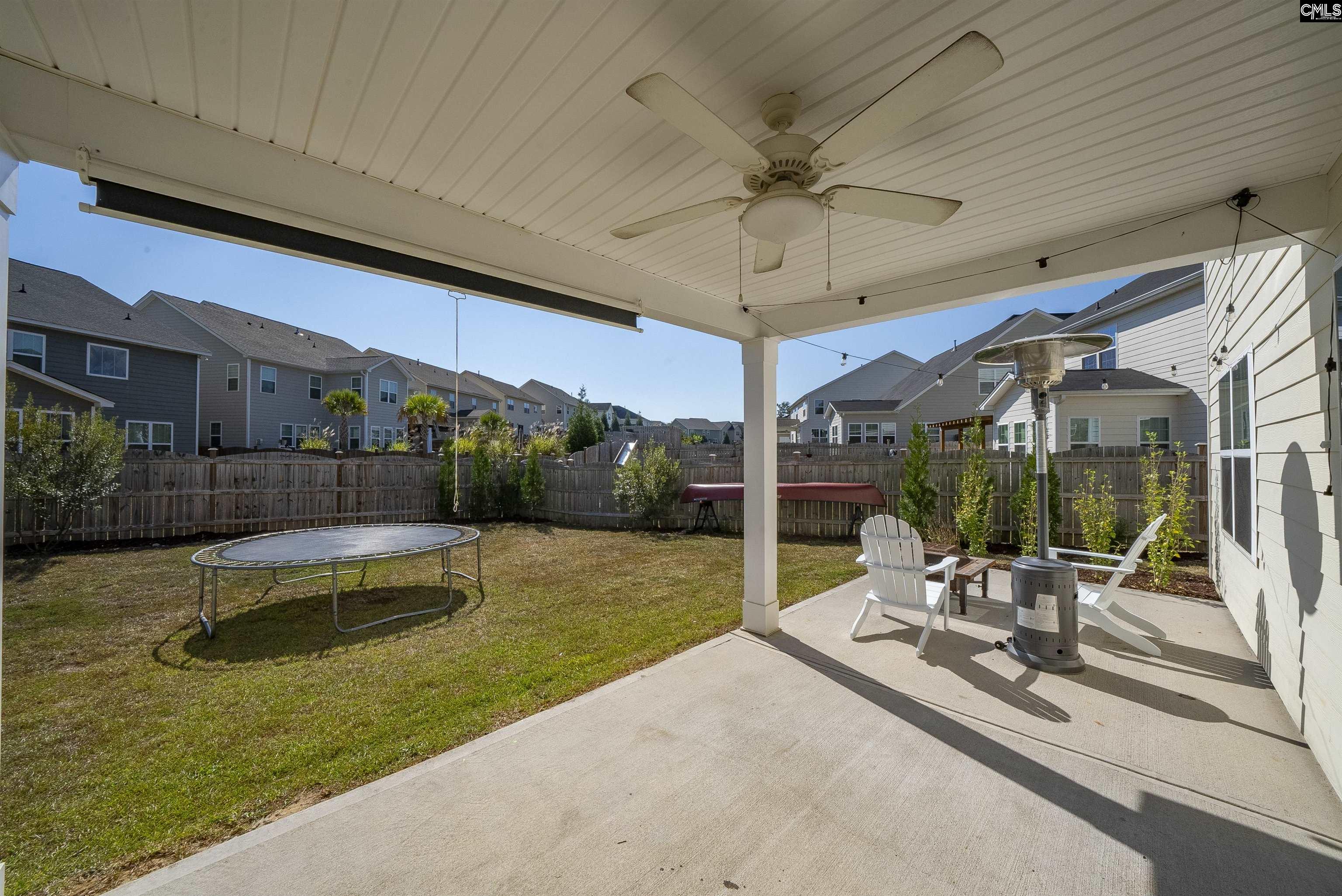 515 Malachite Lane Chapin, SC 29036 - Photo 50 of 63 a view of a patio with a table and chairs