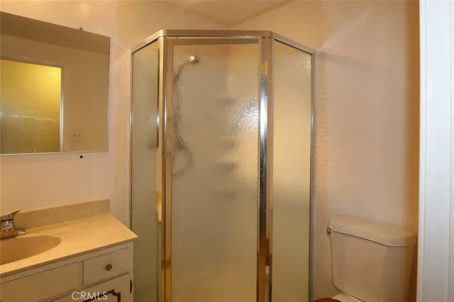 a bathroom with a shower and a sink