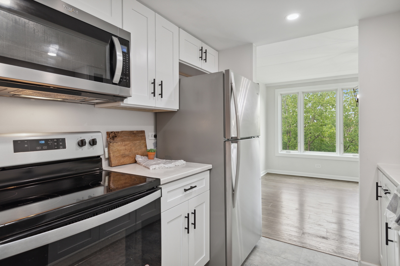 1 Renaissance Place, Unit 417 Palatine, IL 60067 - Photo 7 of 26 a kitchen with stainless steel appliances a refrigerator and a stove top oven