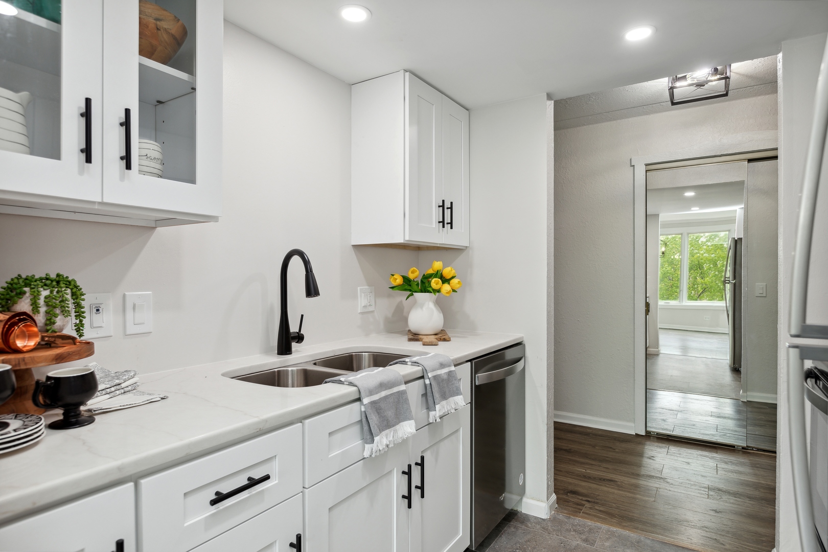1 Renaissance Place, Unit 417 Palatine, IL 60067 - Photo 8 of 26 a kitchen with stainless steel appliances granite countertop a sink and a refrigerator