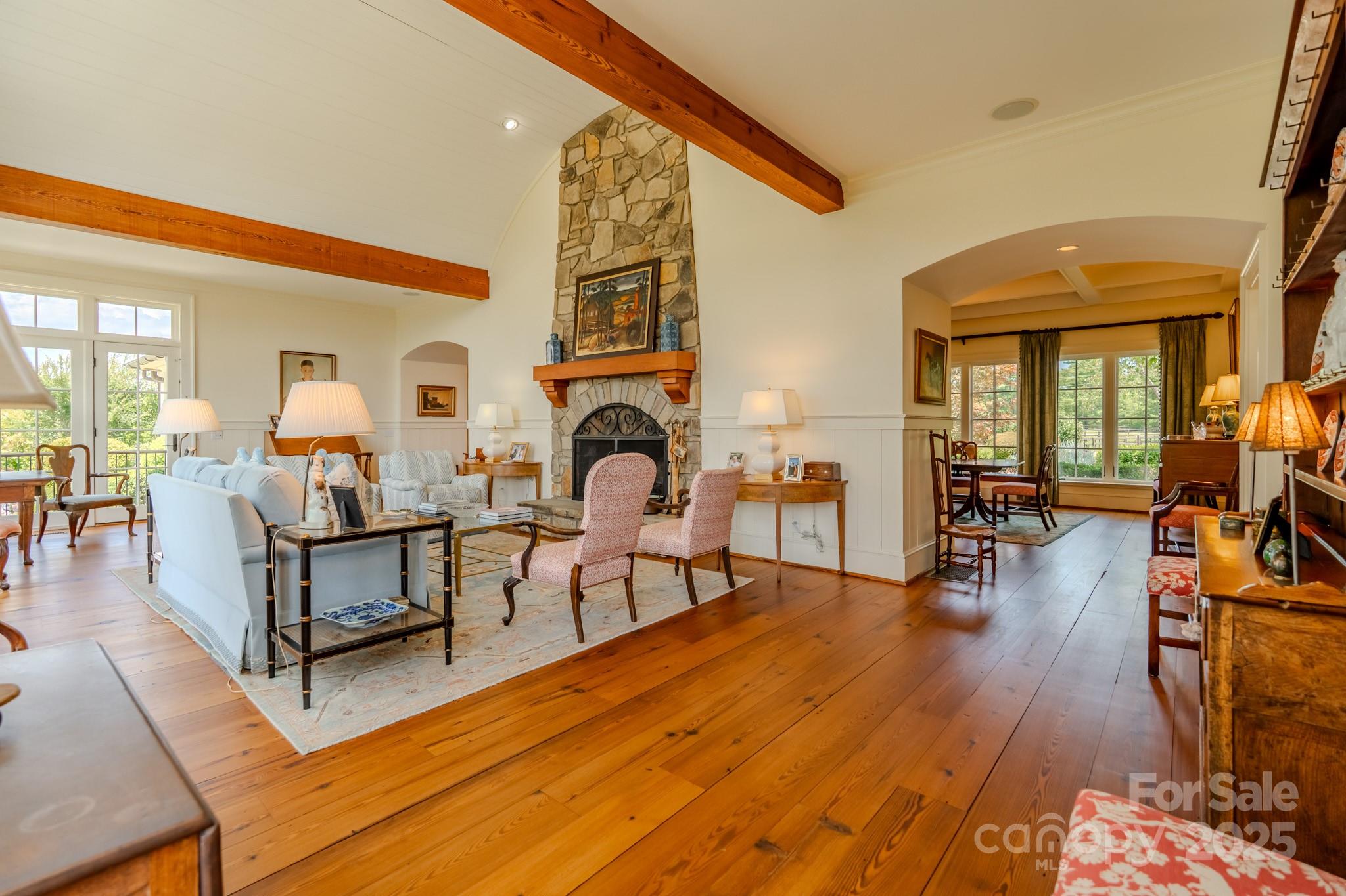 650 Golf Course Road Tryon, NC 28782 - Photo 15 of 48 a living room with furniture a fireplace and wooden floor