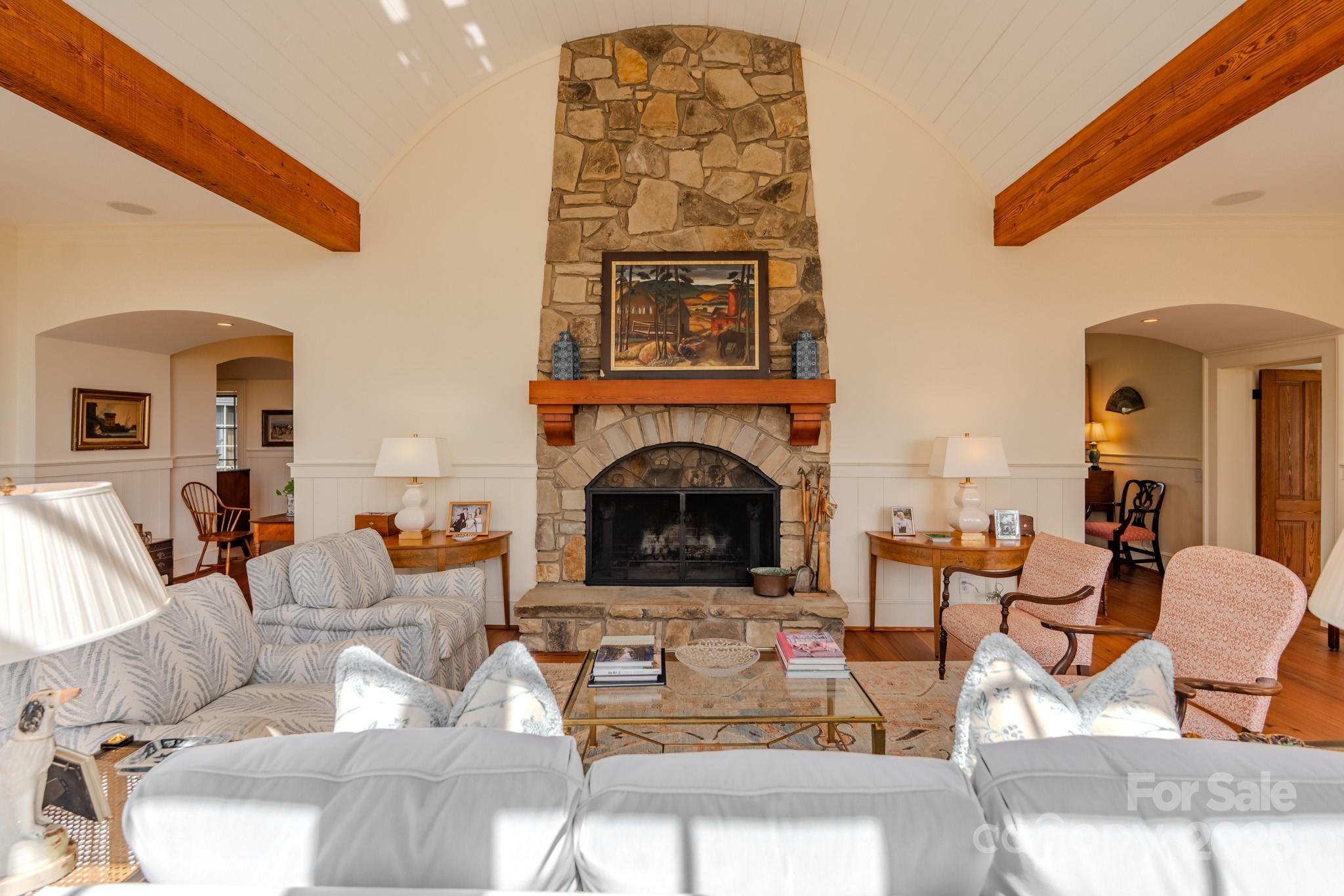 650 Golf Course Road Tryon, NC 28782 - Photo 16 of 48 a living room with furniture a fireplace and a flat screen tv