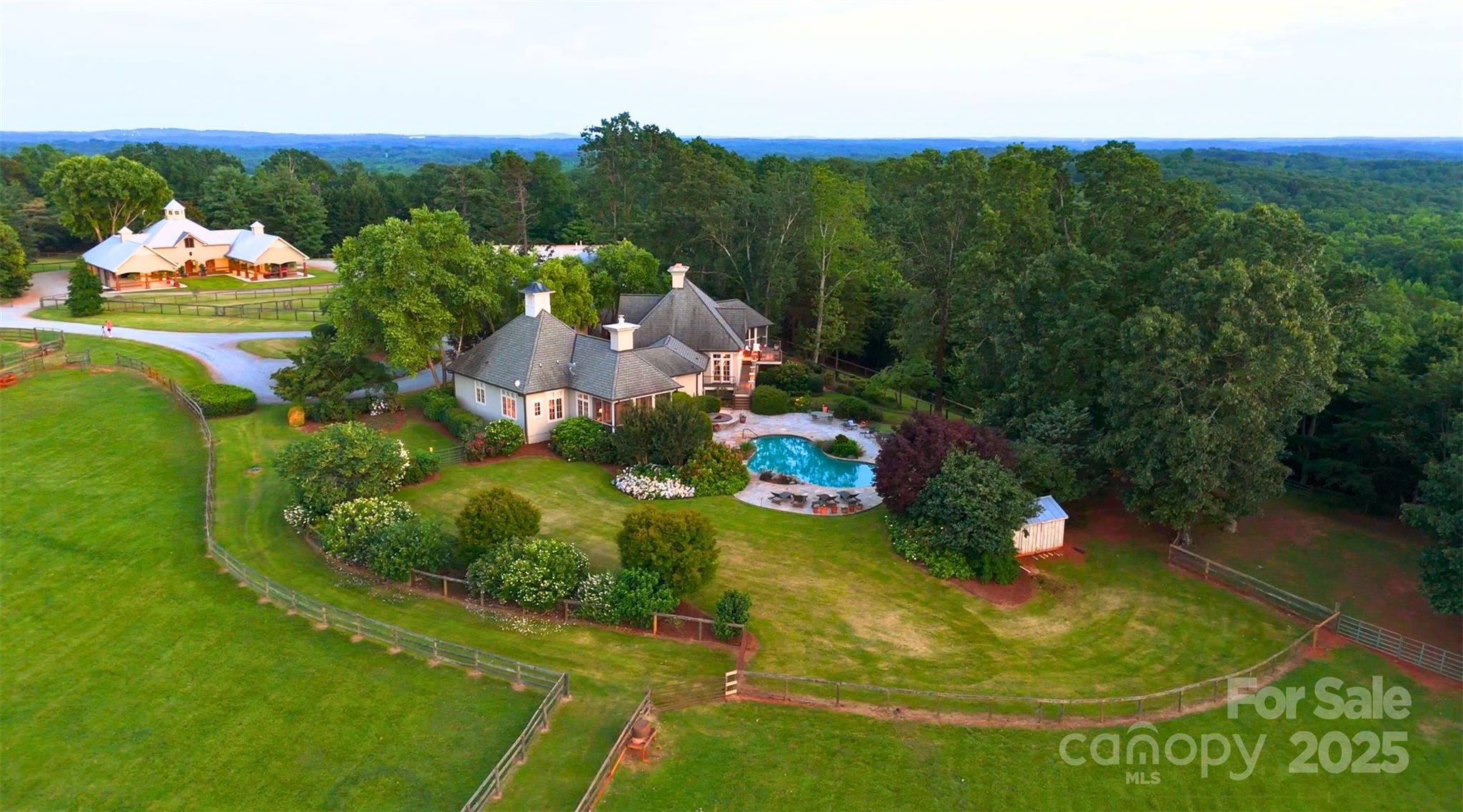 650 Golf Course Road Tryon, NC 28782 - Photo 2 of 48 a view of a swimming pool with a yard