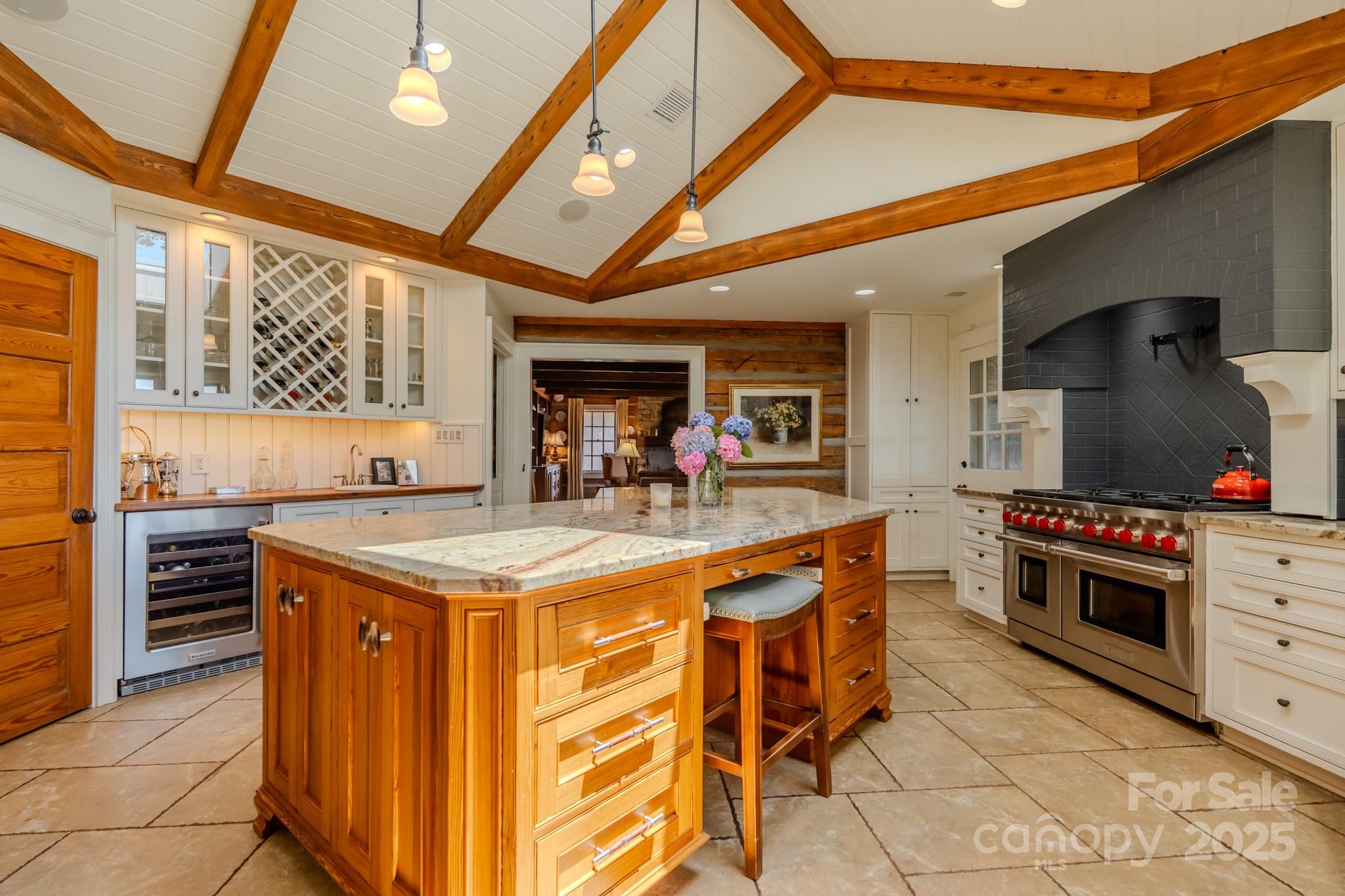 650 Golf Course Road Tryon, NC 28782 - Photo 22 of 48 a kitchen with stainless steel appliances granite countertop a stove and a refrigerator