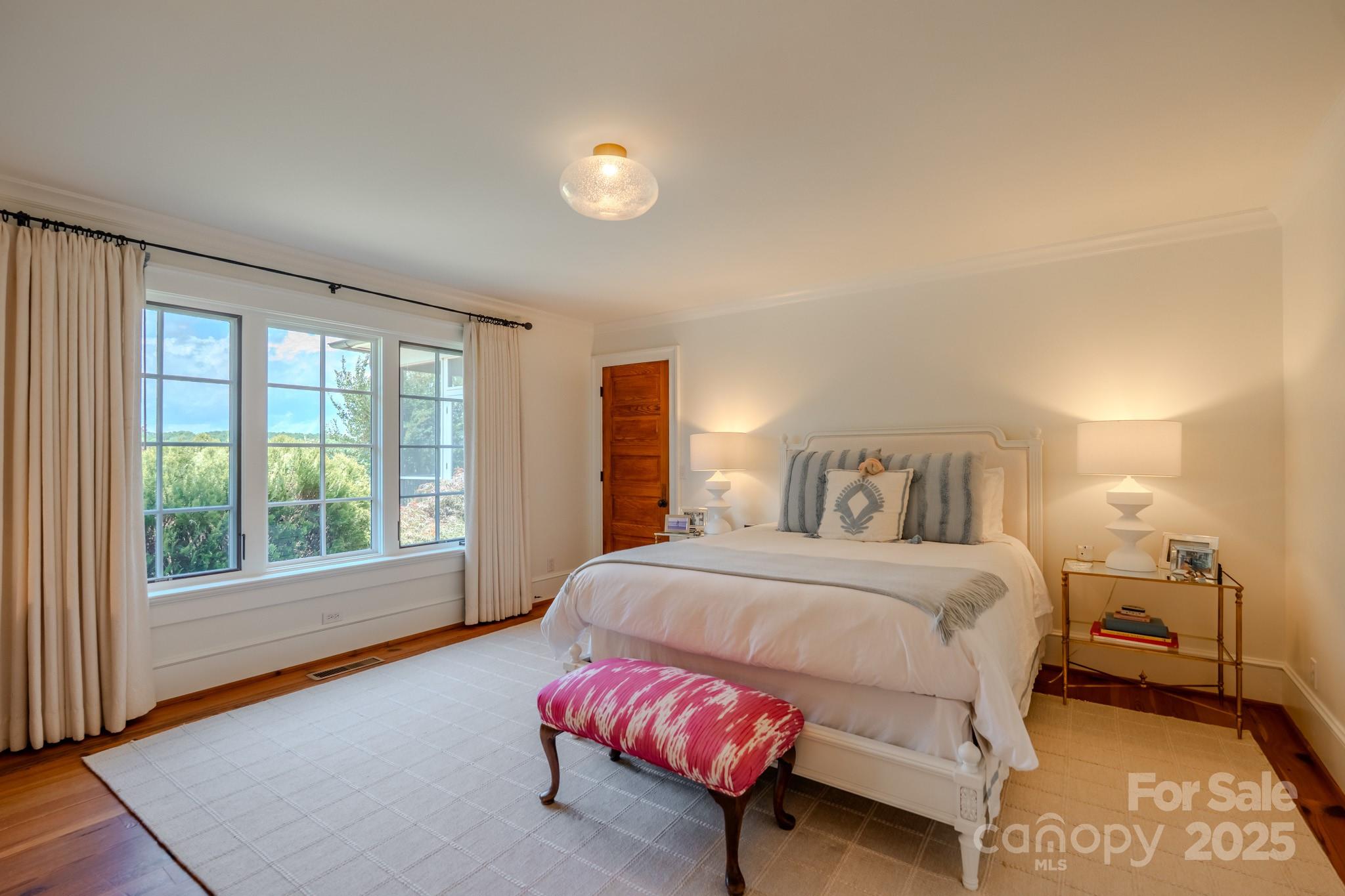 650 Golf Course Road Tryon, NC 28782 - Photo 27 of 48 a bedroom with a bed and a large window