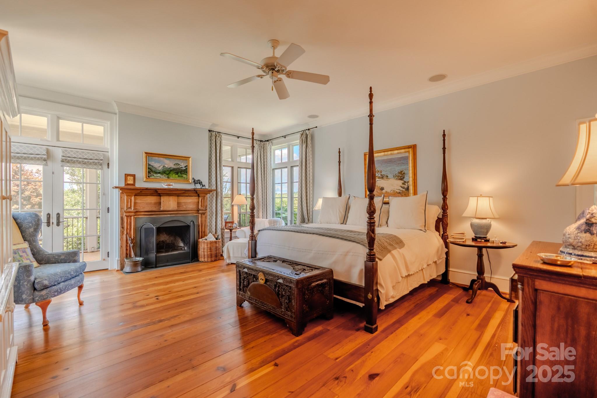 650 Golf Course Road Tryon, NC 28782 - Photo 30 of 48 a spacious bedroom with a bed and wooden floor