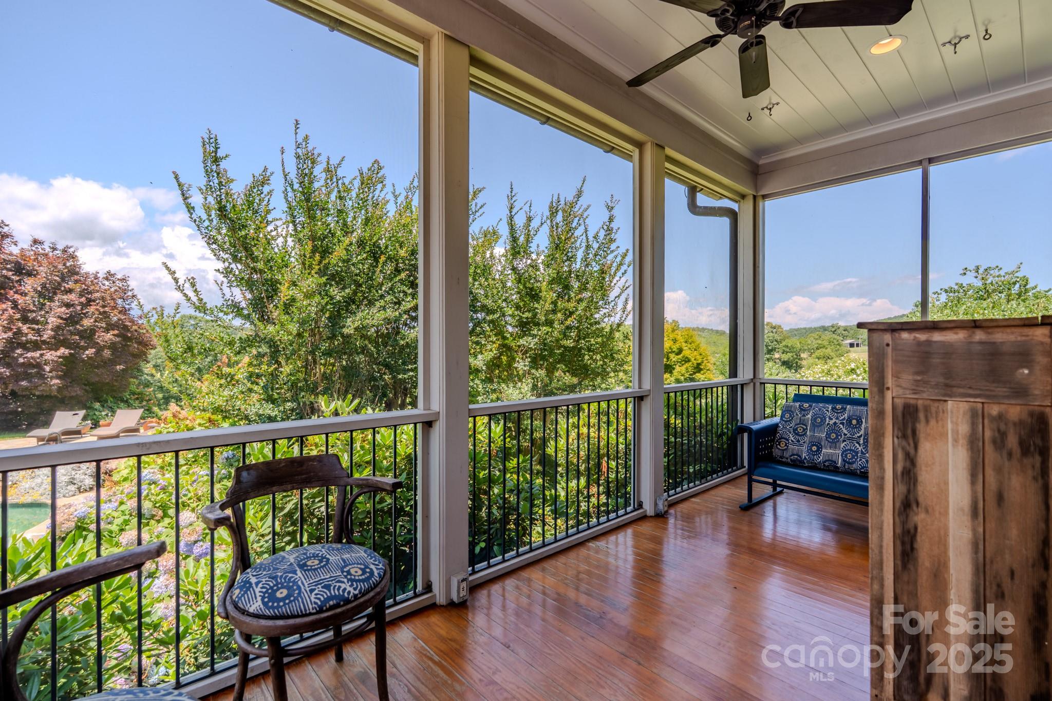 650 Golf Course Road Tryon, NC 28782 - Photo 31 of 48 a view of a balcony with furniture and a potted plant